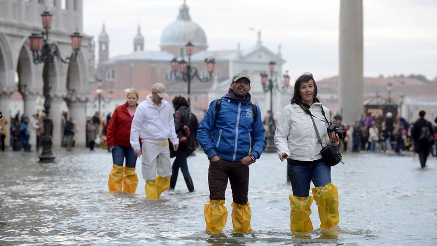 St Mark's square floods during the first 'acqua alta' of the season.