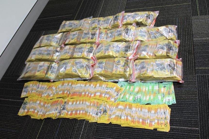 Bundles of cash that was found in a car by police in Perth.