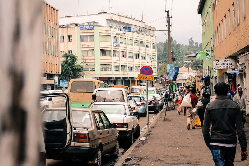 People walk down a congested street in the Ethiopian capital Addis Ababa