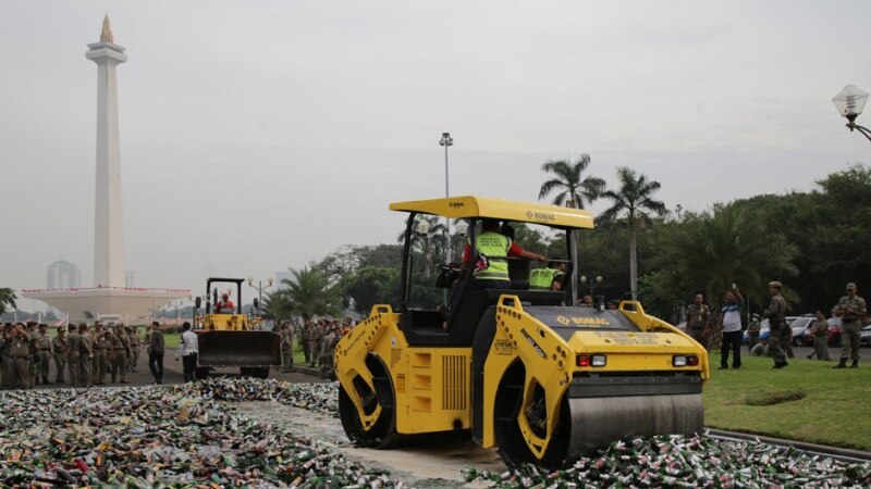 A steamroller crushes 20,000 bottles of alcohol in Jakarta.