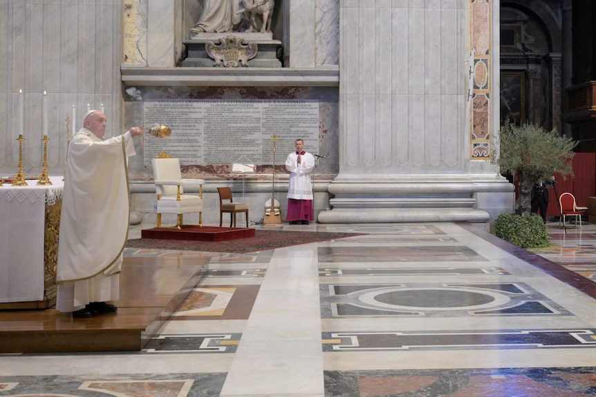 Pope Francis celebrates Easter Sunday Mass in a near-empty St Peter's Basilica.