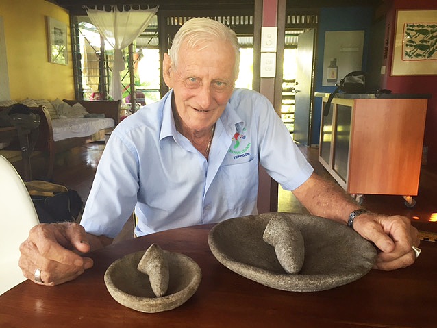 John McQueen, with stone items found by his brother James in the 1970s.