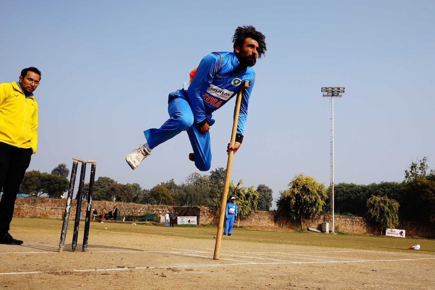 Physically impaired player in a game of cricket in India.