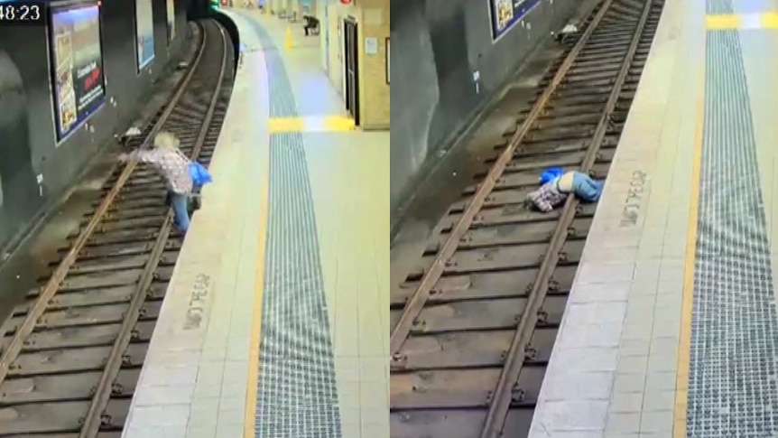 a man falling onto rail tracks