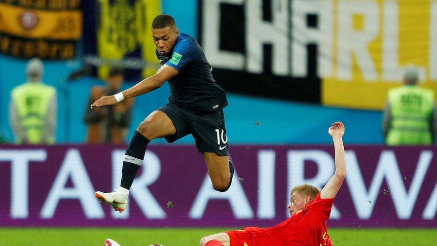 Kylian Mbappe skips past Kevin de Bruyne