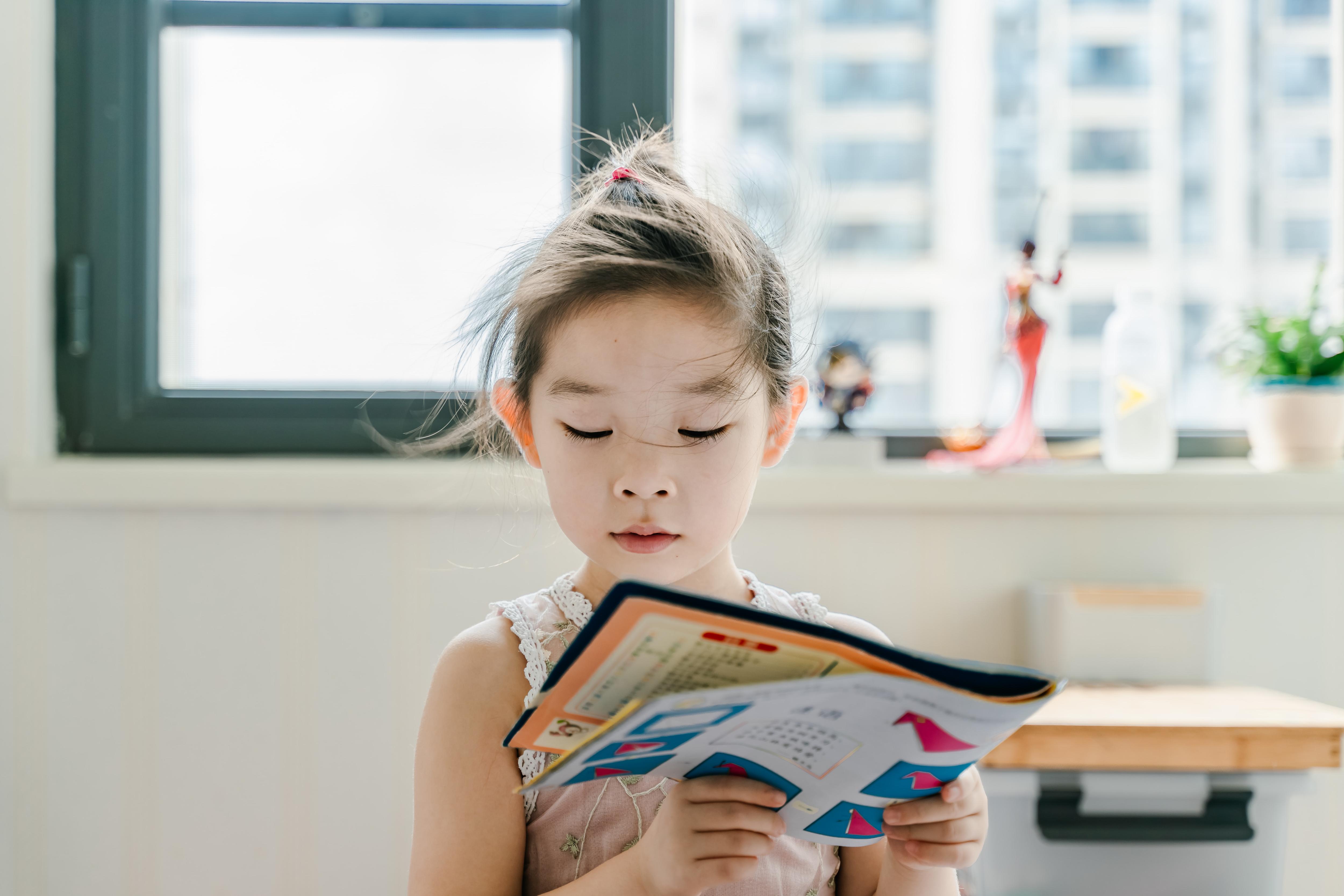 Young girl reading book