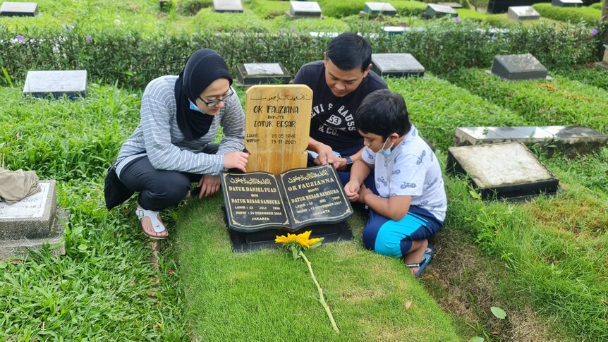 Andrian in the cemetery visit mum's grave