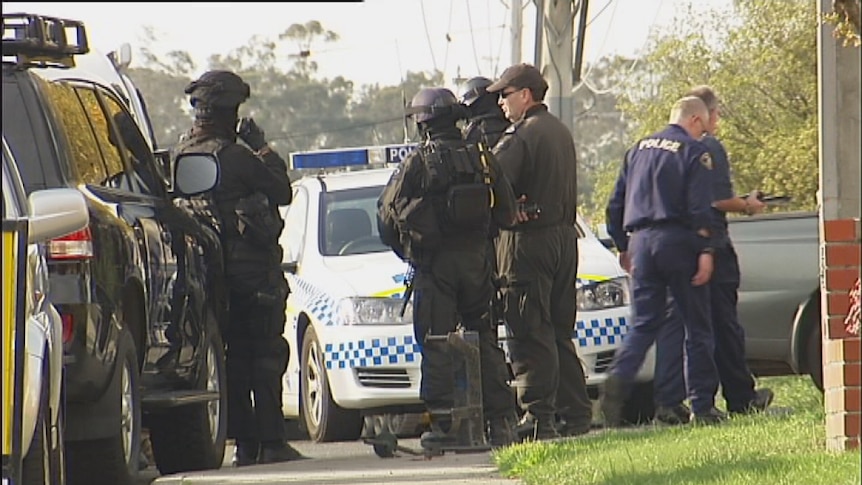 Tasmanian Police outside the Kingston house