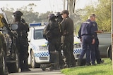 Tasmanian Police outside the Kingston house