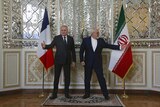 Iranian foreign minister at press conference  with French counterpart