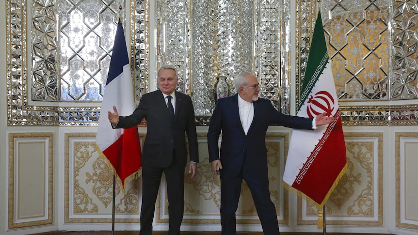 Iranian foreign minister at press conference  with French counterpart