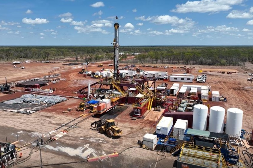 a gas exploration well with drill rig and equipment. 