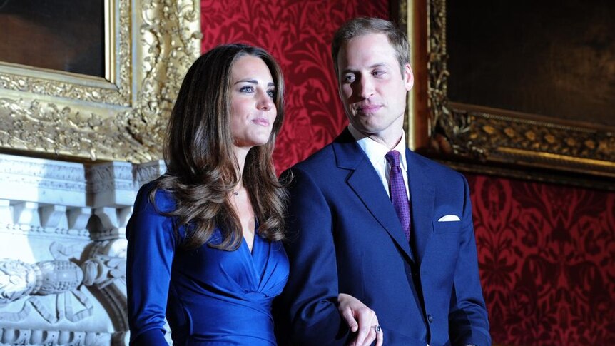 Prince William looks at Kate Middleton during a photocall to mark their engagement