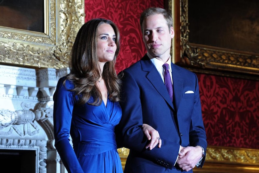 Prince William looks at Kate Middleton during a photocall to mark their engagement