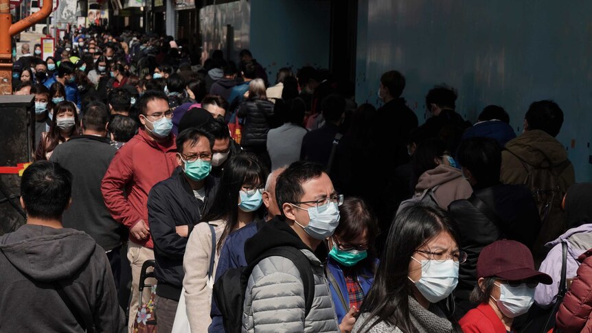 People queue up to buy face masks in Hong Kong.