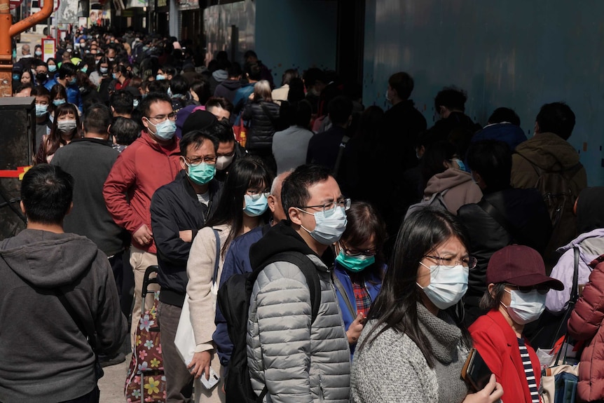 People queue up to buy face masks in Hong Kong.