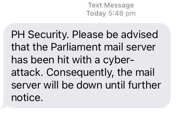 A screenshot of a text message from Parliament House security advising that there had been a cyber attack