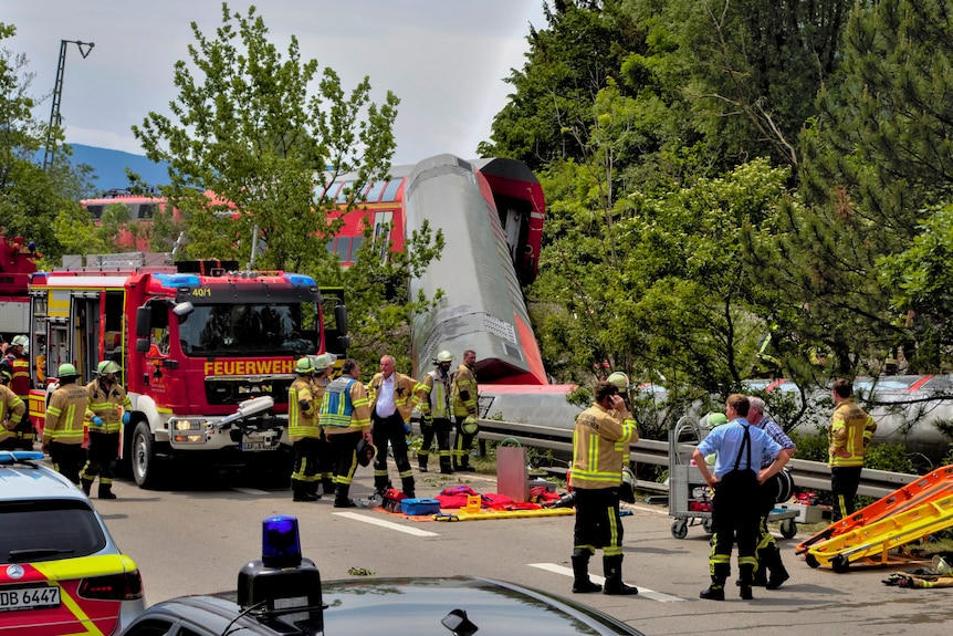 Emergency services gather at the scene of a train derailed. 