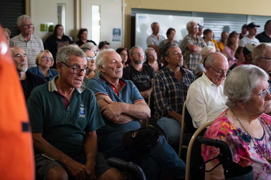 A group of people at a bushfire community meeting.