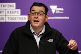 Victorian Premier Daniel Andrews gestures as he speaks at a press conference.