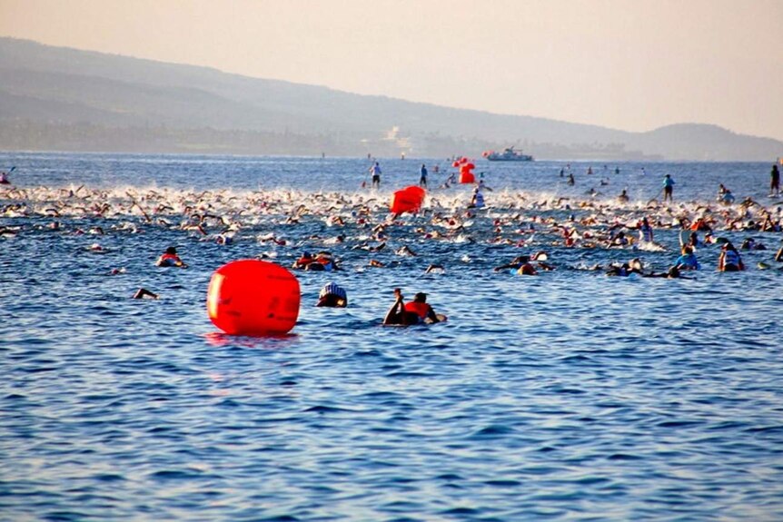 Hawaii Ironman swimmers in the water