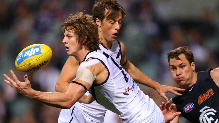 Nat Fyfe juggles a mark for the Dockers against Gold Coast in July, 2014.