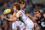 Nat Fyfe juggles a mark for the Dockers against Gold Coast in July, 2014.