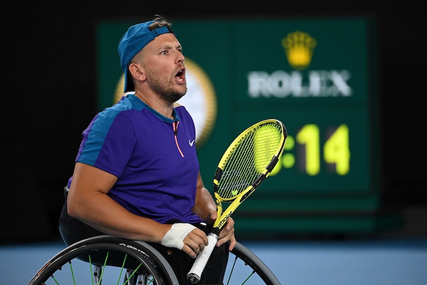 Dylan Alcott yells up towards his box while on court