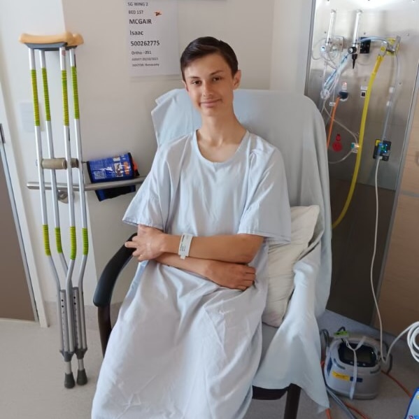 A boy in hospital with crutches