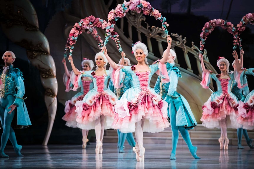 Artists dressed in pink and blue perform in David McAllister's The Sleeping Beauty at the Sydney Opera House.