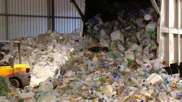 A huge pile of plastic bottles at a recycling centre