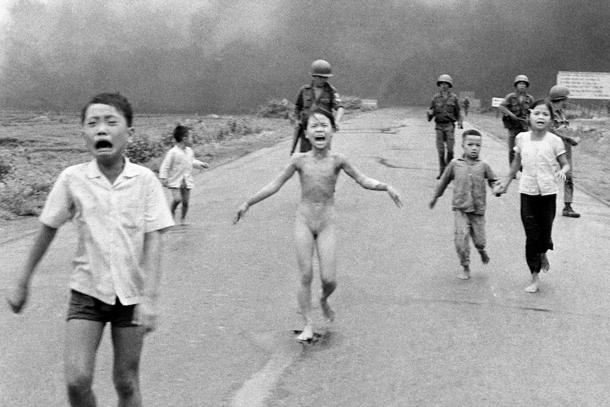 Terrified children, including 9-year-old Kim Phuc, are running after a South Vietnamese plane accidentally dropped napalm