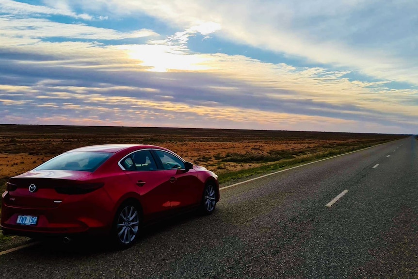 A car travels along highway near Broken Hill outback