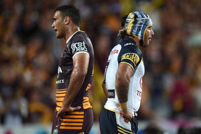 Johnathan Thurston of the Cowboys (left) and Justin Hodges of the Broncos during the 2015 NRL grand final
