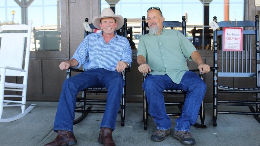 Dean Perrett and Larry Marrs sitting in rocking chairs smiling at the camera.