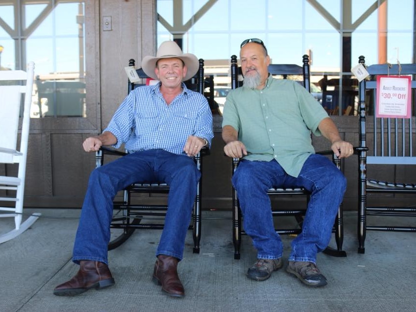 Dean Perrett and Larry Marrs sitting in rocking chairs smiling at the camera.