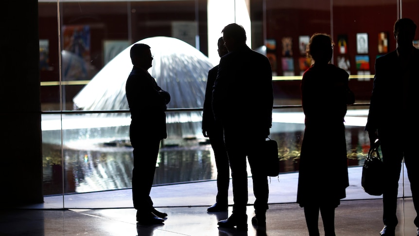 A silhouette of a group of people