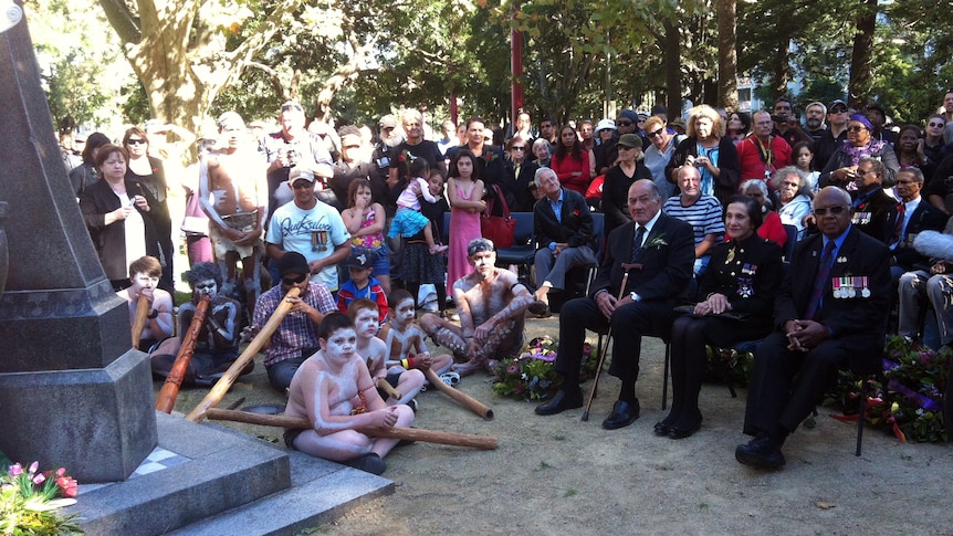 Marie Bashir sits with Indigenous ex-servicemen in Redfern before the Coloured Diggers March.