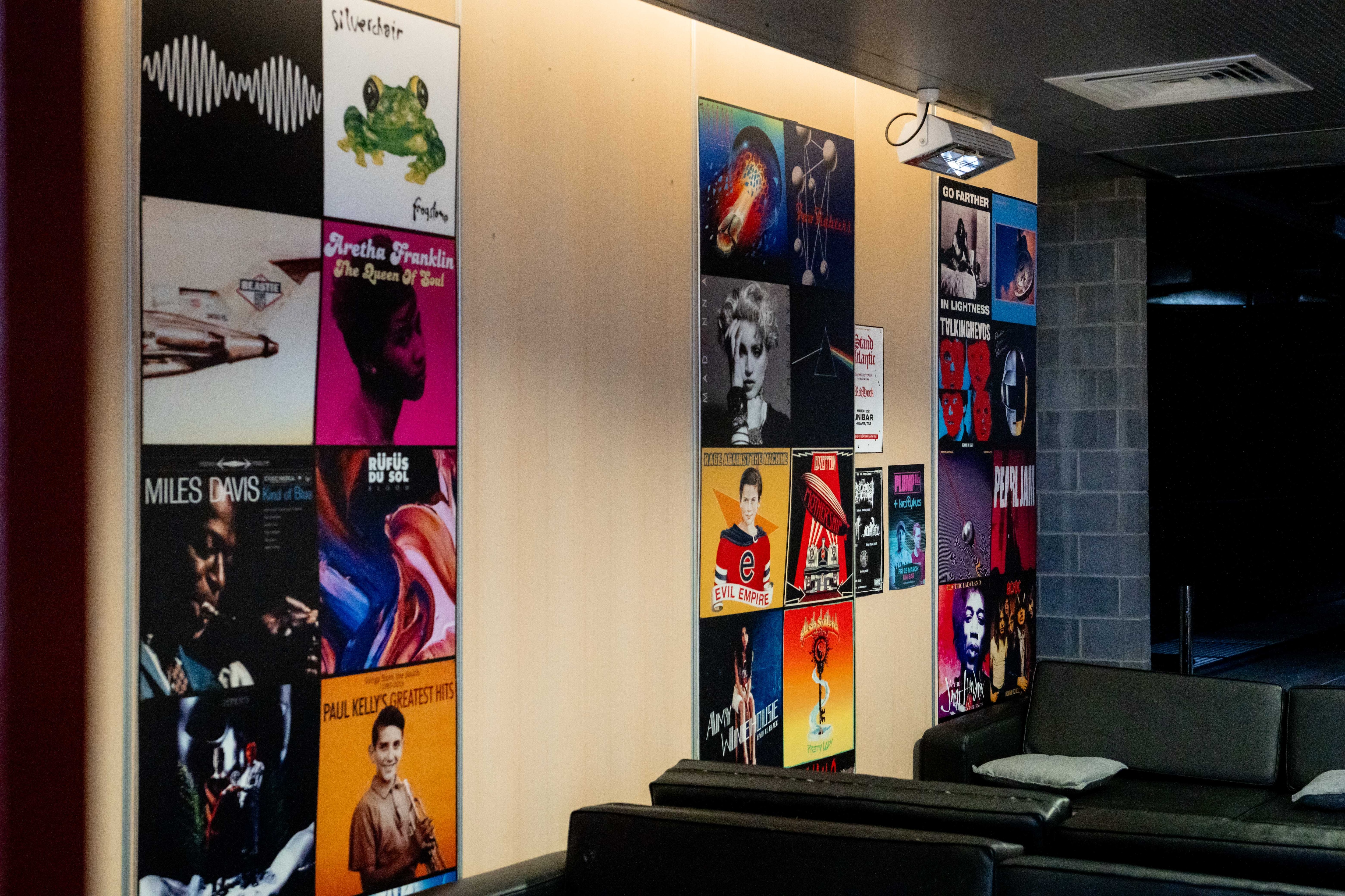 Bar interior with music poster on wall