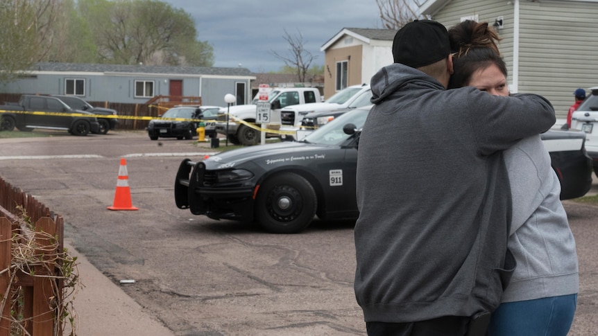 People embrace after Colorado trailer park shooting