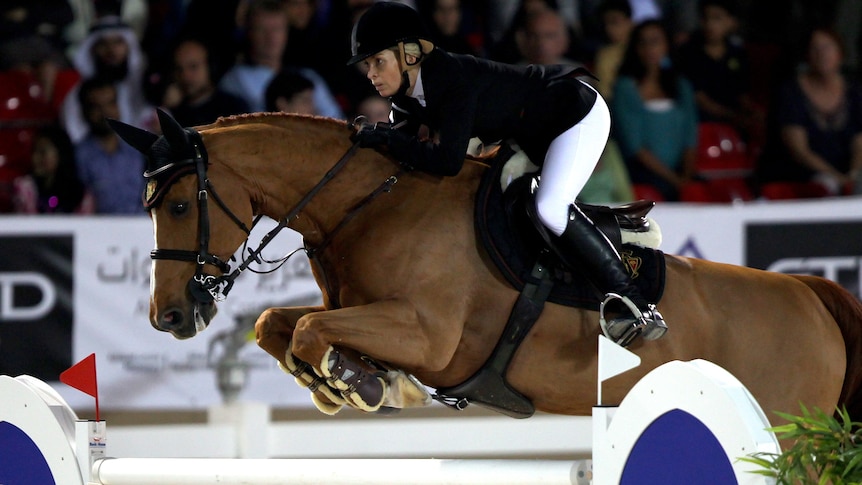 Edwina Tops-Alexander of Australia clears a jump on her horse Cevo Itot Du Chateau