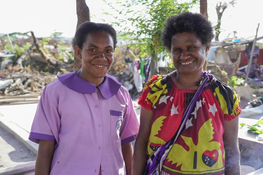 A mother and daughter from Papua New Guinea smiling.