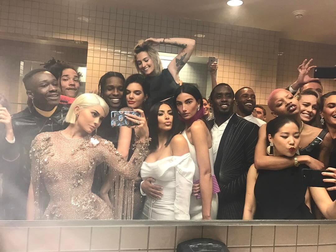 A group of celebrities in a bathroom. 
