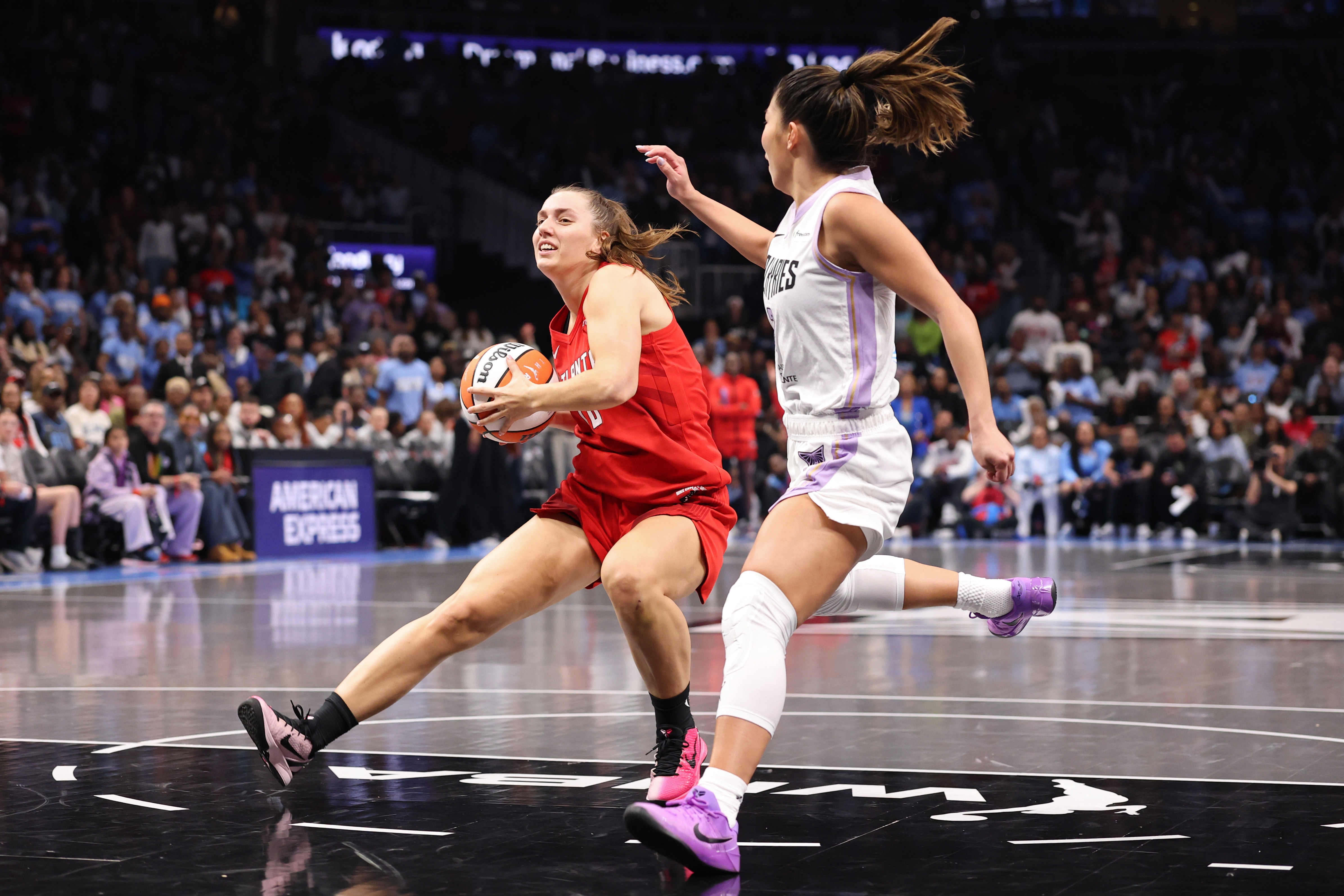 Atlanta Dream players Izzy Borlase is defended by Kaitlyn Chen of the Golden State Valkyries in the WNBA finals.