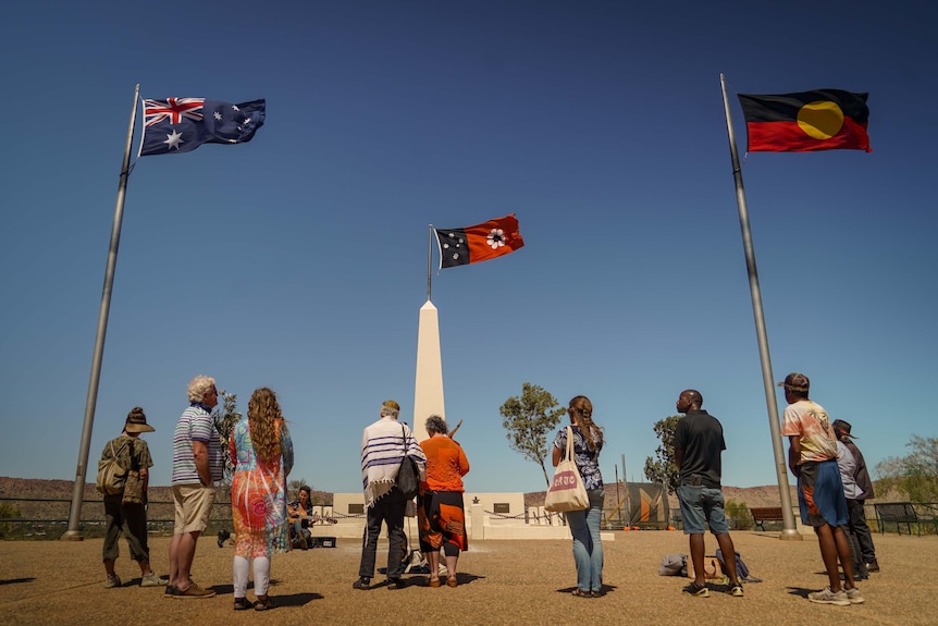 A group of people stand on Anzac Hill