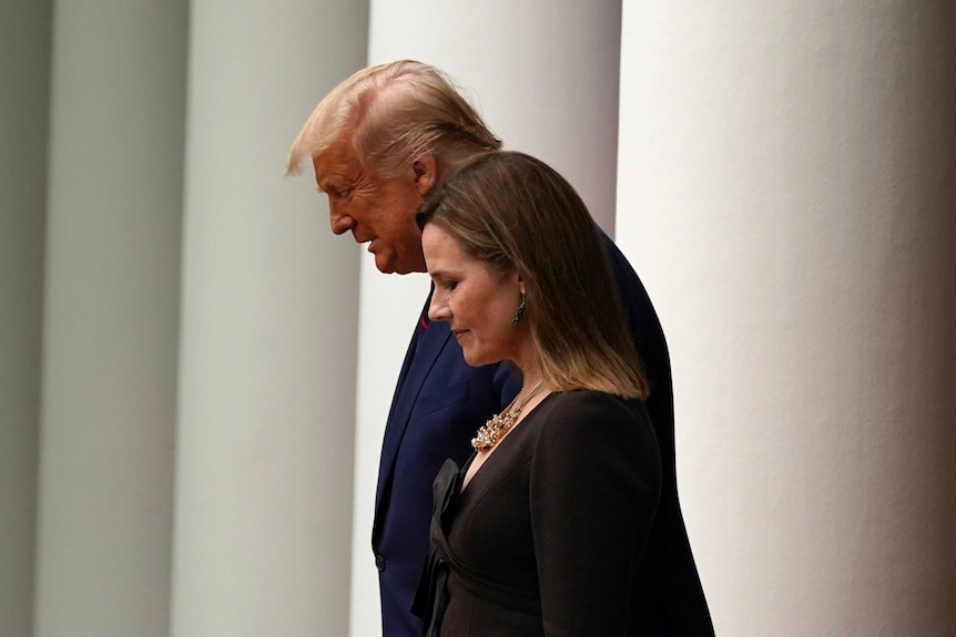 President Donald Trump walks with Judge Amy Coney Barrett