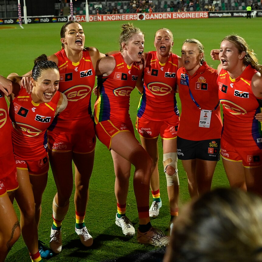 The Suns celebrate after winning the round 10 AFLW match