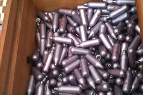 A box full of empty nitrous oxide canister, or nangs