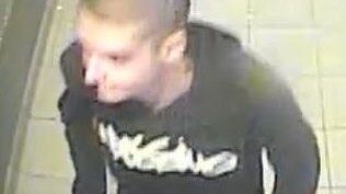 A CCTV image shows a teenager with a shaved head and a hooded jumper.