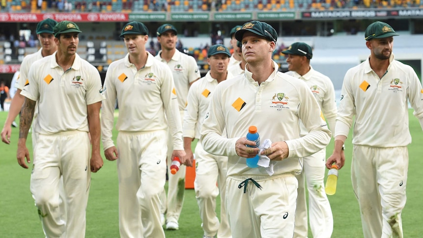 Steve Smith leads his troops off at the Gabba